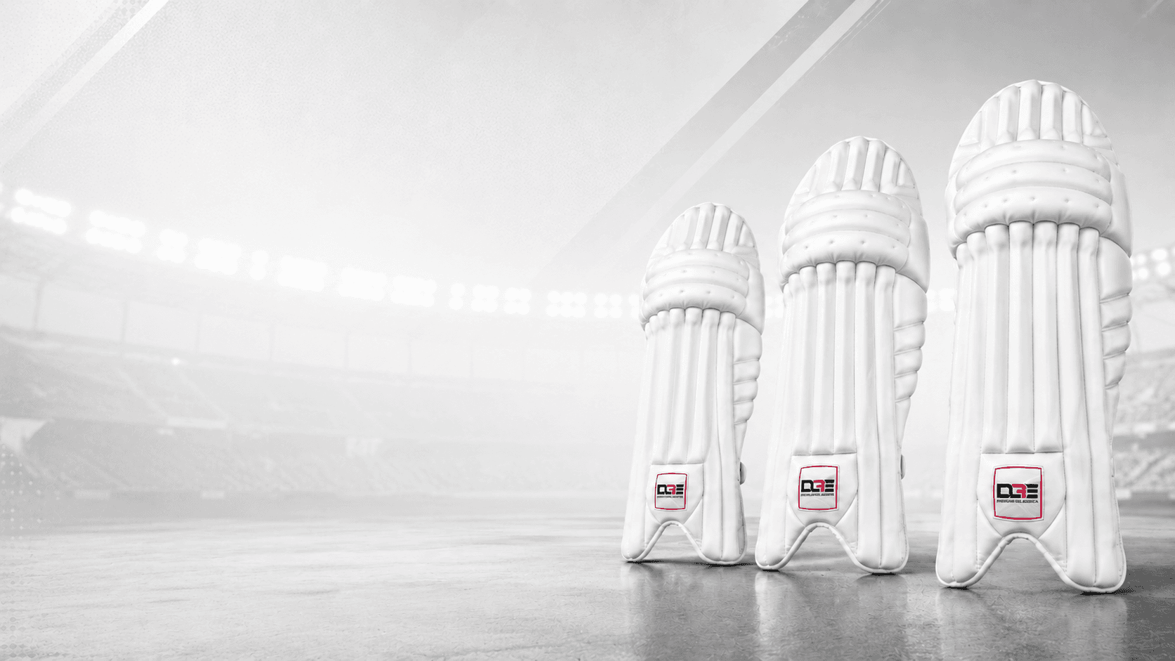 Three pairs of Daksh Global Exports batting pads in a stadium
